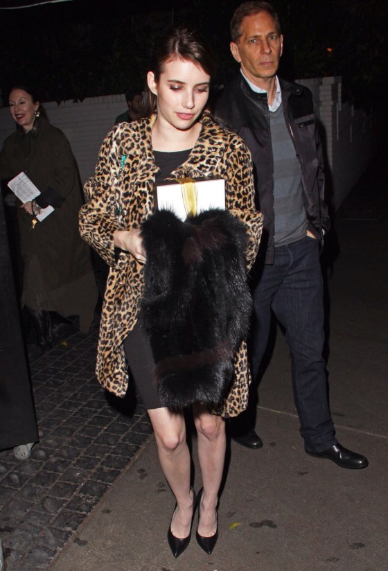 **EXCLUSIVE** Actress Emma Roberts seen wearing a animal print fur coat, black dress and a turquoise Chanel purse while leaving from the Chateau Marmont in Hollywood